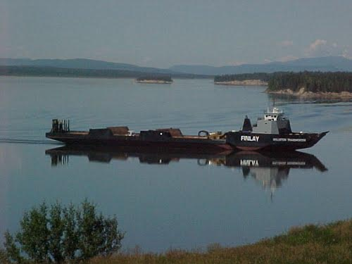 The MV Williston Transporter icebreaking barge crossing Williston Lake.